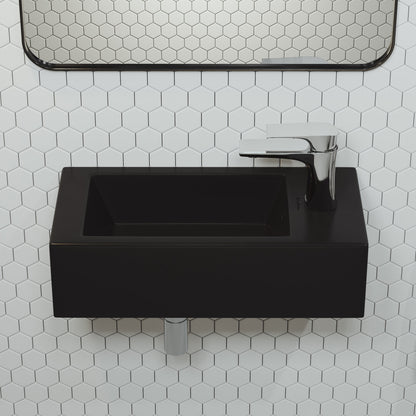 Matte black rectangular wall-hung ceramic sink with right side faucet mount, minimalist design.
