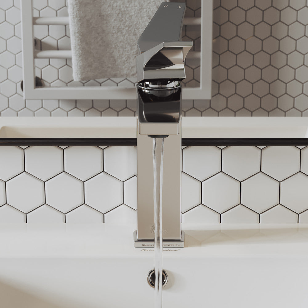 Single-handle bathroom faucet in chrome, sleek modern design with a square base and rounded spout.
