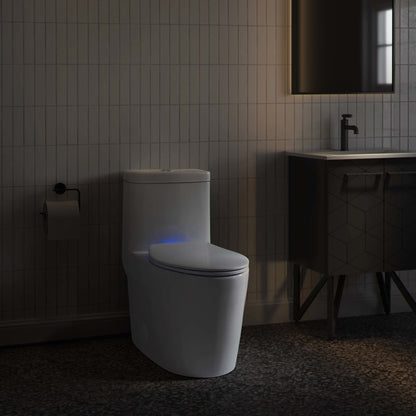 Elongated toilet with quick-release seat and blue night light, contemporary bathroom setting.