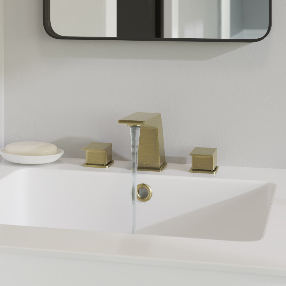 Widespread bathroom faucet in brushed gold, two-handle design with square base and curved spout.