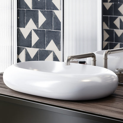 Oval white ceramic vessel sink with smooth rounded edges on wooden countertop.
