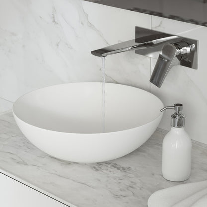 Wall-mount single-handle bathroom faucet in chrome above white round vessel sink on marble countertop.