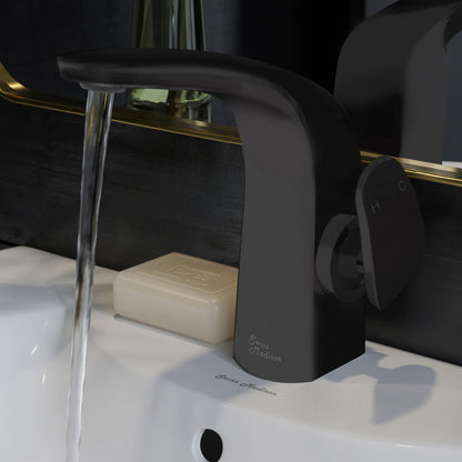 Single-handle bathroom faucet in matte black, modern curved design, water flowing from spout.