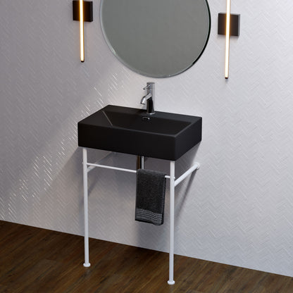 Compact ceramic console sink with matte black basin and matte white legs, single faucet hole.