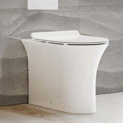 Elongated back-to-wall toilet bowl with smooth skirted trapway and soft-close seat in white ceramic.