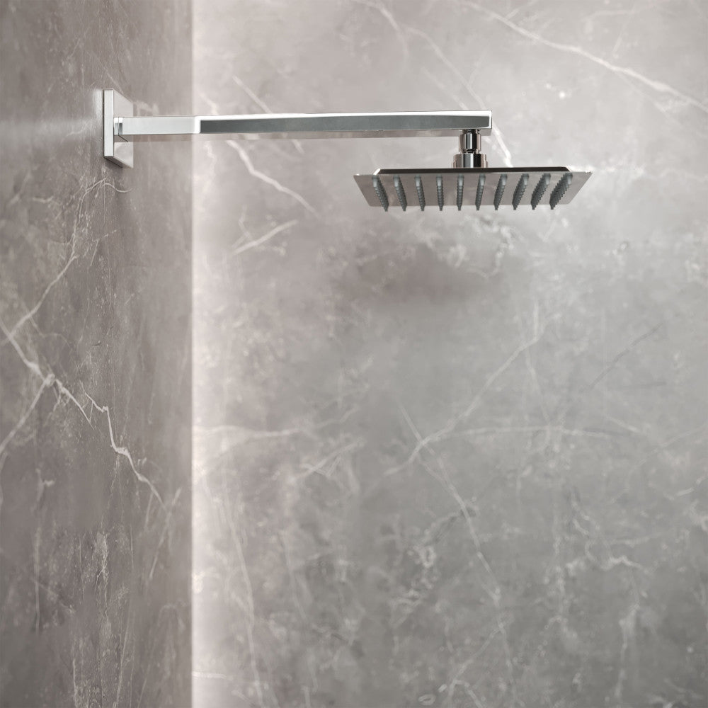 Chrome wall-mounted fixed shower head with single-handle valve and square rainfall design.