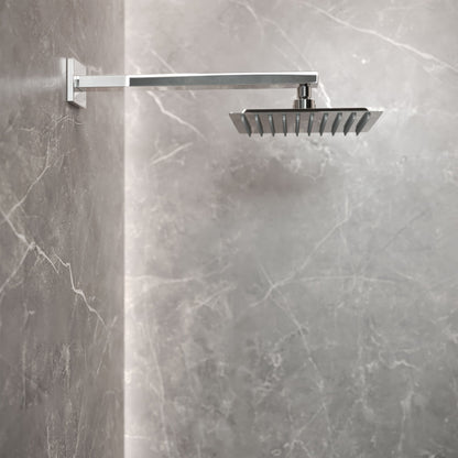 Chrome wall-mounted fixed shower head with single-handle valve and square rainfall design.