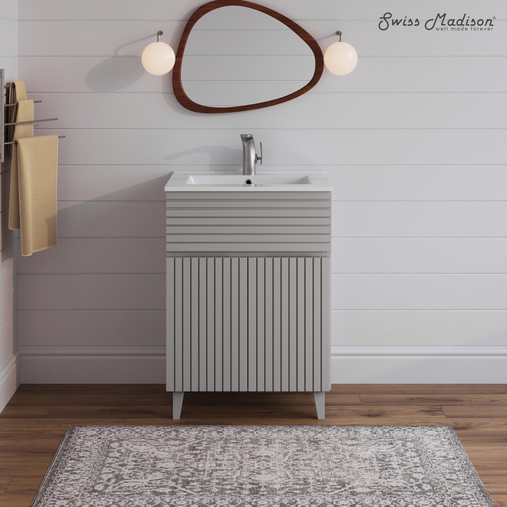 24-inch freestanding bathroom vanity in shell with single sink and textured front panel.