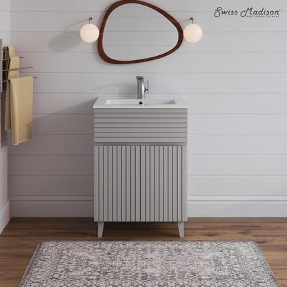 24-inch freestanding bathroom vanity in shell with single sink and textured front panel.