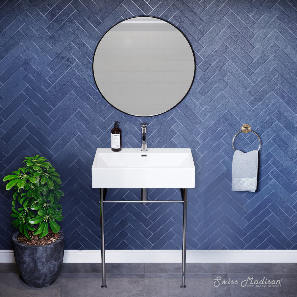 White ceramic console sink with chrome legs and wall-mounted faucet, modern bathroom vanity setup.