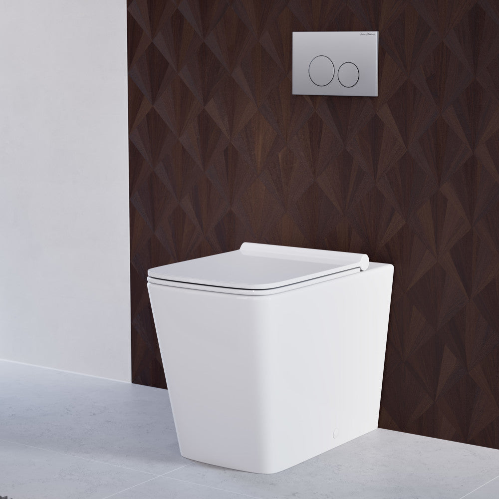 Glossy white back-to-wall toilet with concealed tank and soft-close seat against textured dark wall.