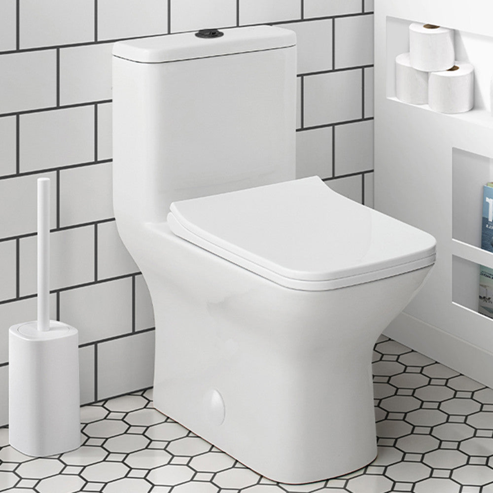 Elongated one-piece toilet with dual flush and black hardware, modern design.