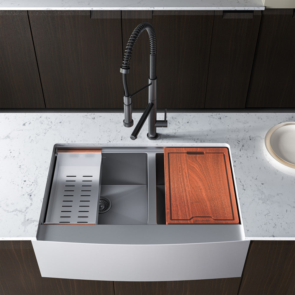33 x 22-inch dual basin farmhouse workstation sink with apron front and included cutting board and colander accessory.