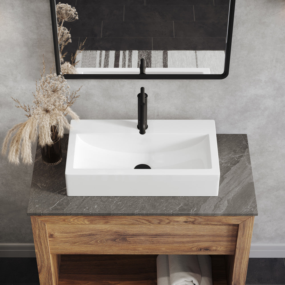 24-inch rectangular white vessel sink with center drain on wooden vanity countertop.