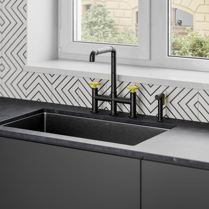 Widespread kitchen faucet in matte black with yellow handles, tall curved spout.