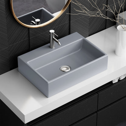 20" rectangular matte gray ceramic vessel sink with flat sides and central drain hole.