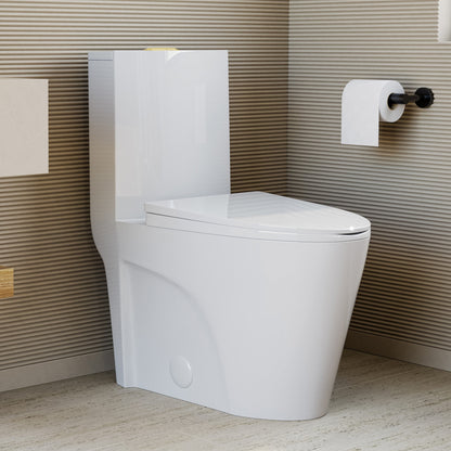 Elongated one-piece white toilet with dual vortex flush and gold hardware in a modern bathroom setting.