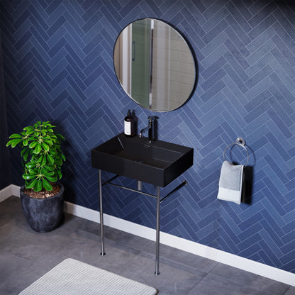Matte black ceramic console sink with chrome legs, rectangular basin, wall-mounted bathroom sink.
