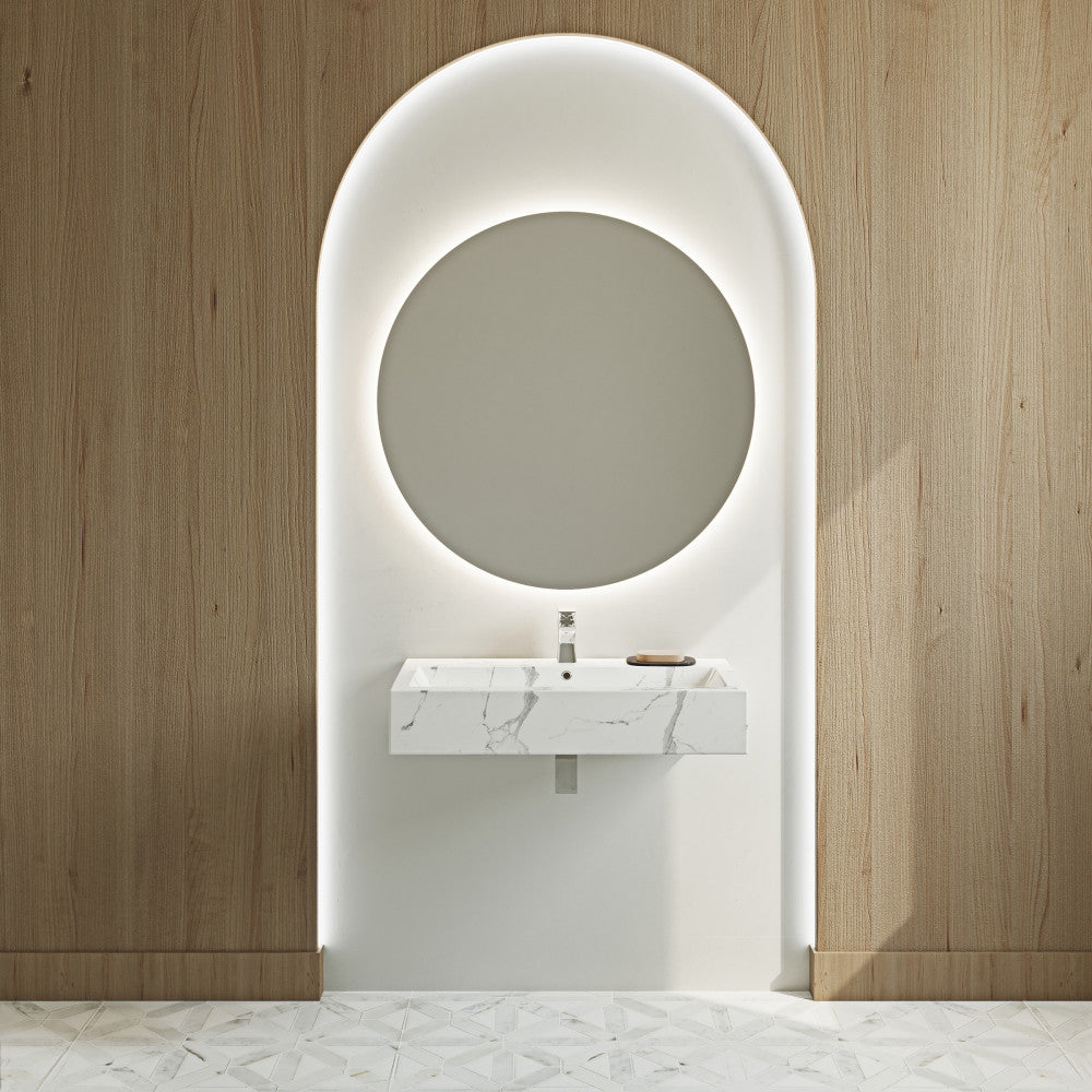 Wide rectangular wall-hung sink in white marble with single faucet hole and integrated overflow drain.
