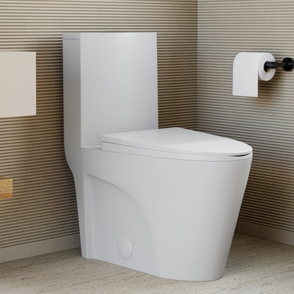 Elongated one-piece toilet in matte white with dual-flush system and smooth skirted trapway design.