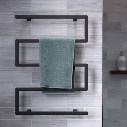 Electric 5-bar towel warmer in matte black with modern geometric design mounted on tiled wall.