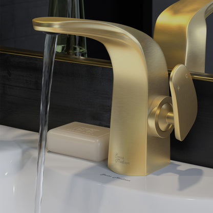 Single-handle bathroom faucet in brushed gold with curved spout and lever handle, water flowing from spout.