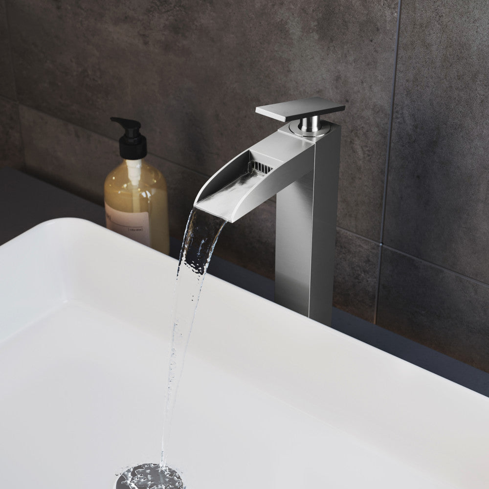 Single-handle high arc bathroom faucet in brushed nickel with waterfall spout.
