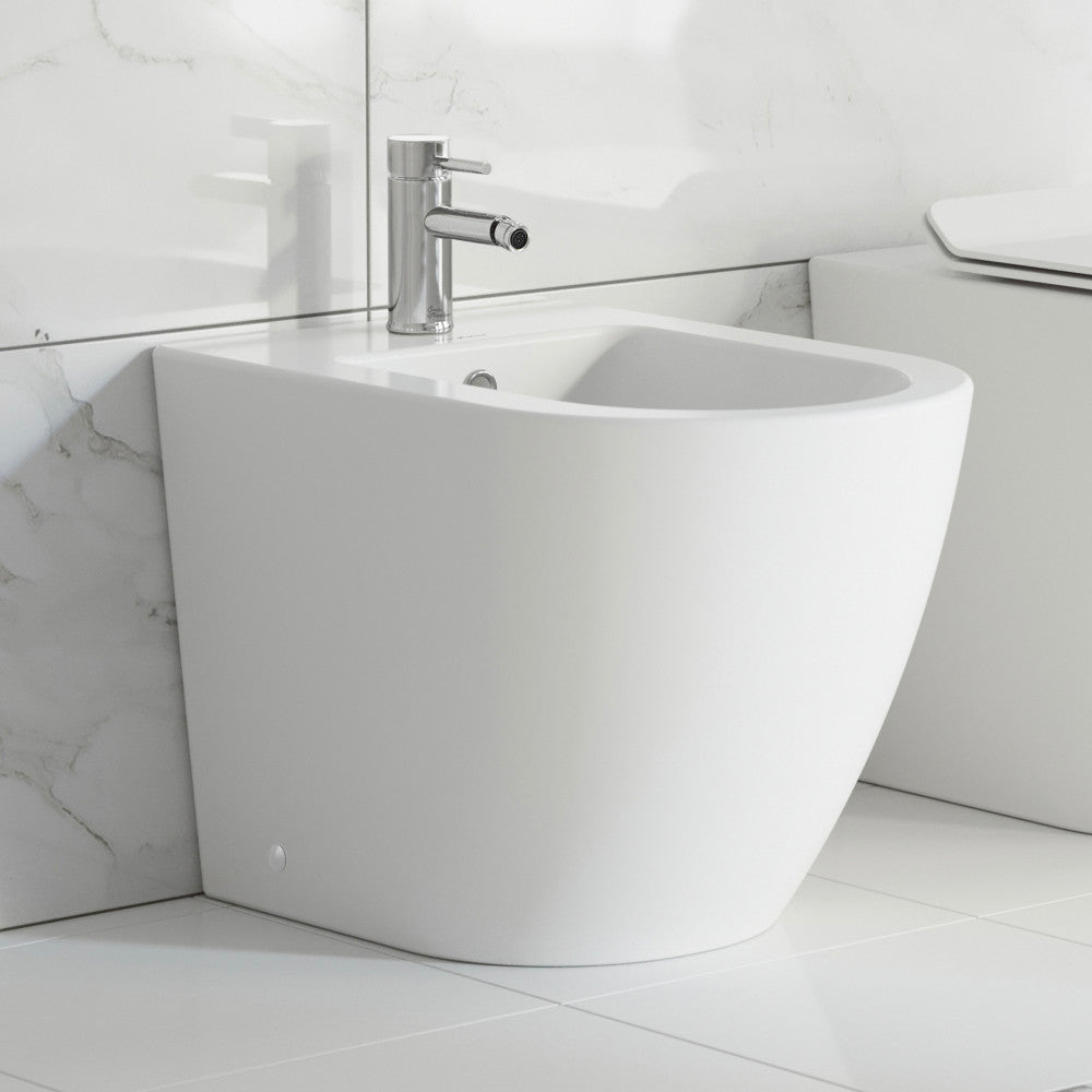 Floor-mount classic bidet in glossy white with single-hole faucet mount and rounded edges.