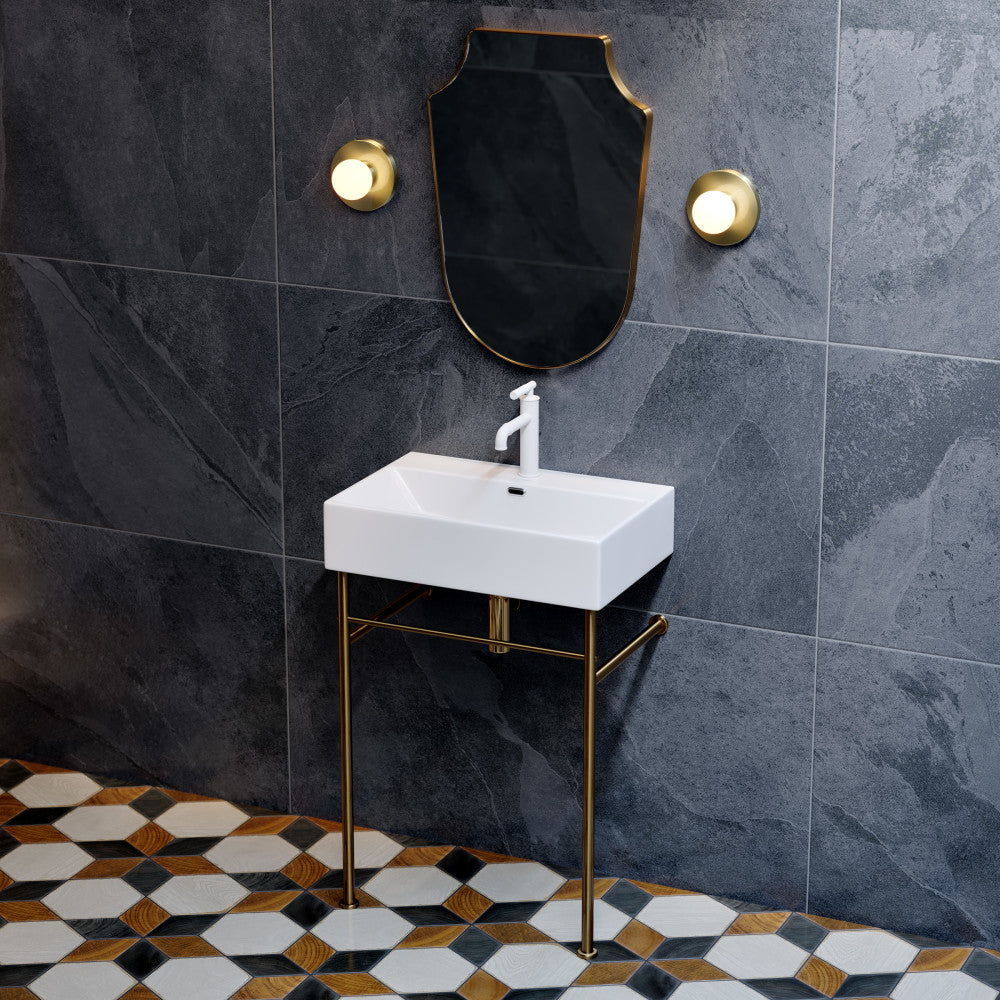 White ceramic console sink with brushed gold legs and single-handle faucet, rectangular basin.
