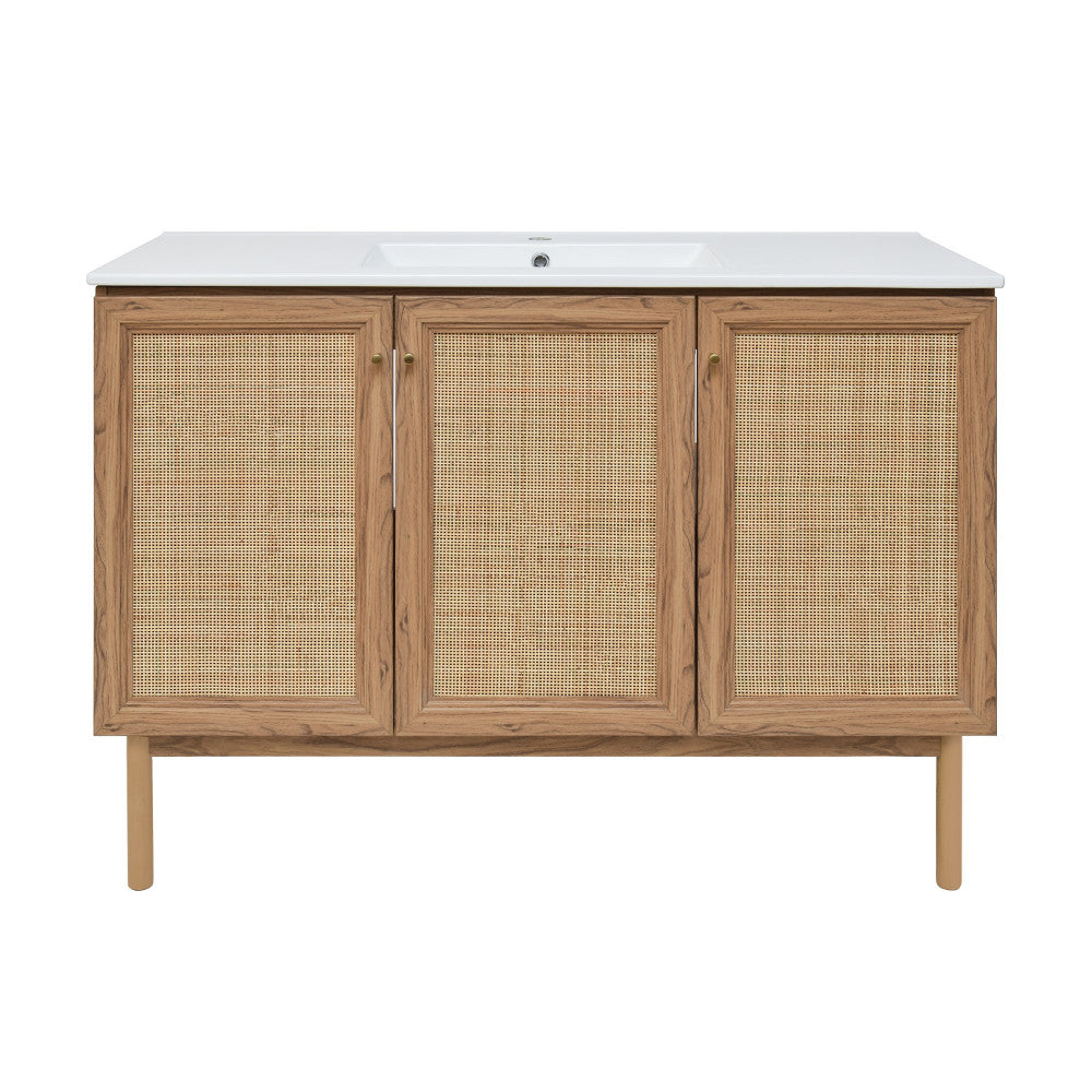 48-inch freestanding bathroom vanity in golden oak with single sink and woven rattan cabinet doors.