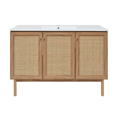 48-inch freestanding bathroom vanity in golden oak with single sink and woven rattan cabinet doors.