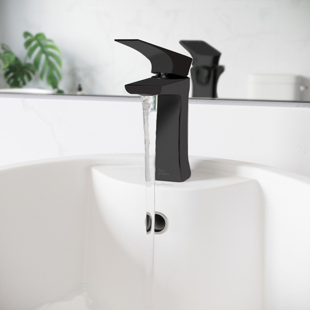 Single-handle bathroom faucet in matte black with angular lever and water flowing from spout.