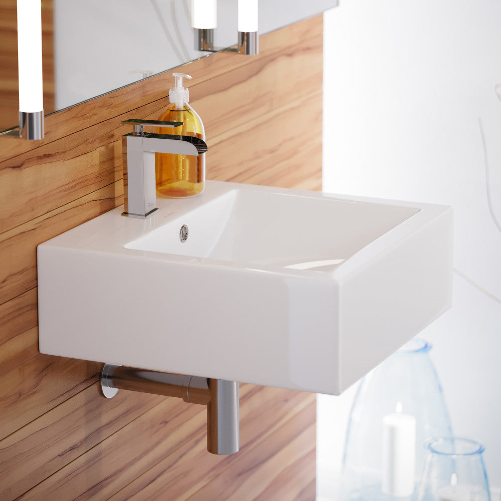 18-inch square white ceramic wall-mount sink with single-handle chrome faucet and overflow drain.