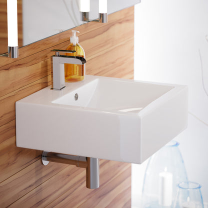 18-inch square white ceramic wall-mount sink with single-handle chrome faucet and overflow drain.