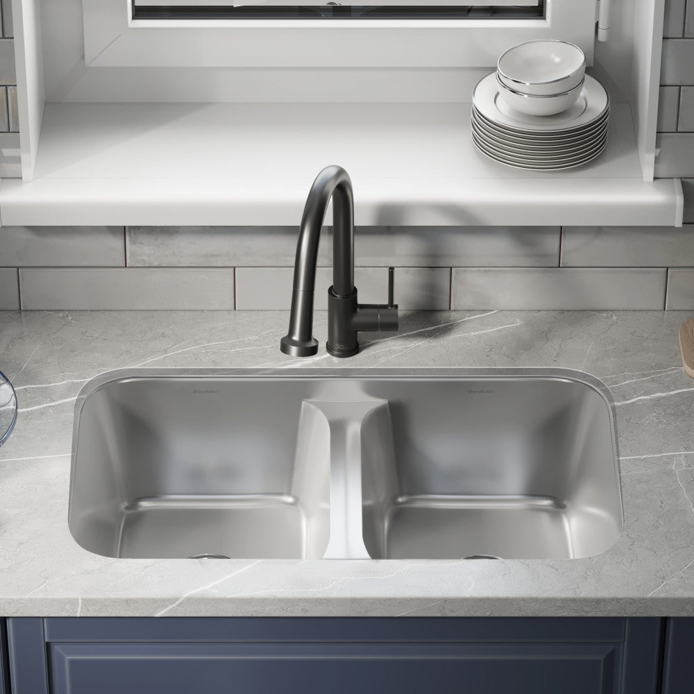 32 x 19 inch stainless steel undermount kitchen sink with dual basins and low divide design.