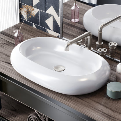 Oval white ceramic vessel sink with smooth curved edges and central drain hole.