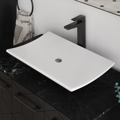 23.5” rectangular white ceramic vessel bathroom sink with centered drain on black countertop.