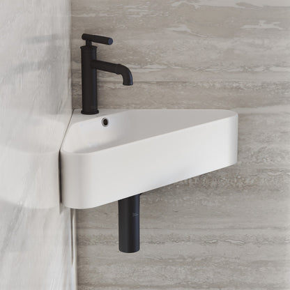 Corner wall-hung bathroom sink in white with black faucet and visible drainpipe.