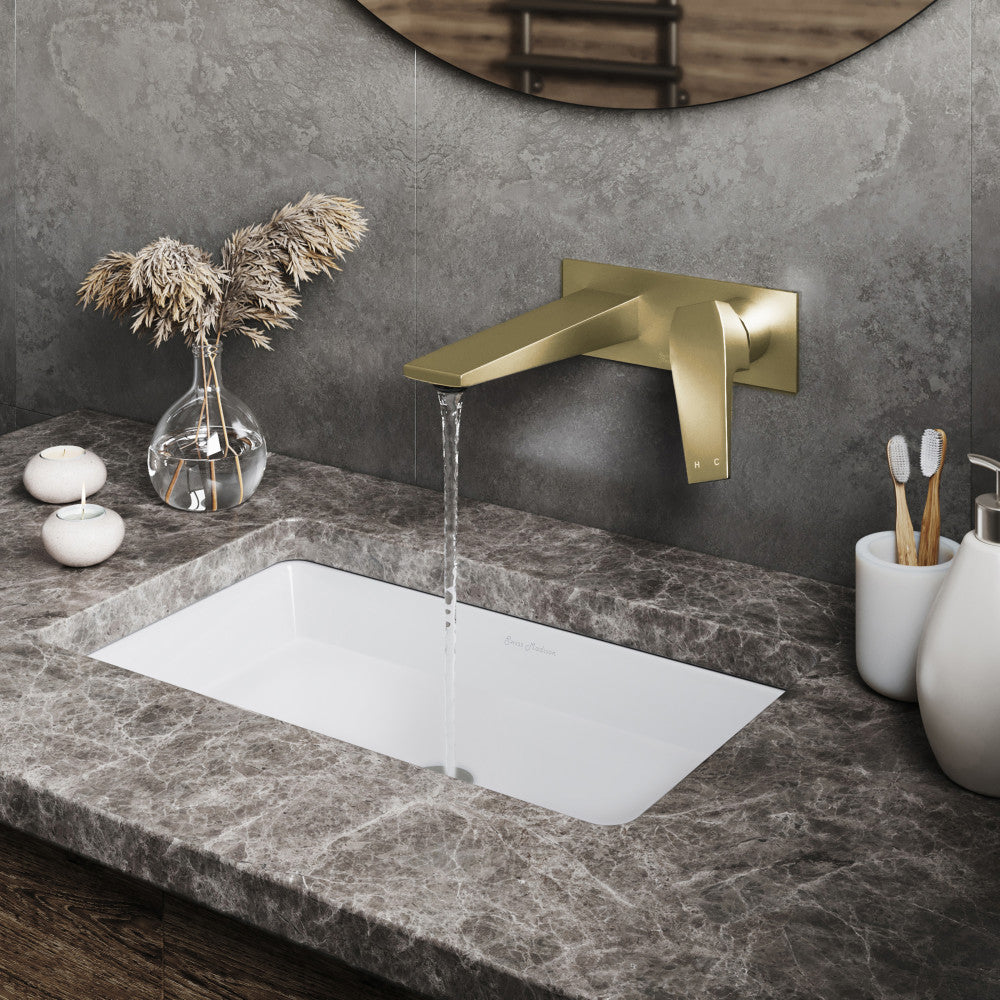 Single-handle wall-mount bathroom faucet in brushed gold with sleek rectangular spout and lever handle.