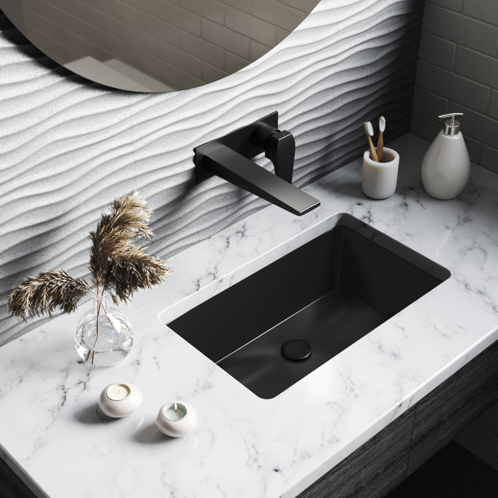 21" rectangular undermount bathroom sink in matte black with modern faucet on white marble countertop.