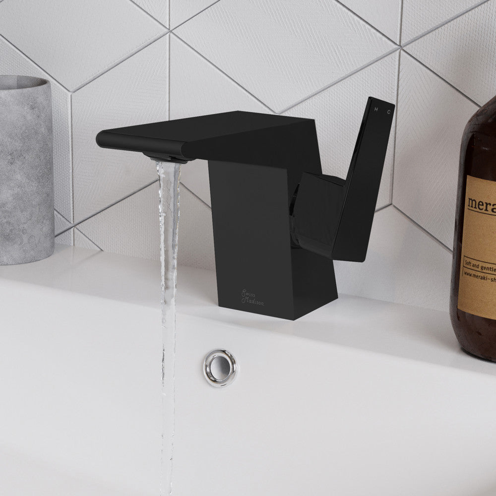 Single-handle bathroom faucet in matte black with angular spout and lever handle, water flowing.