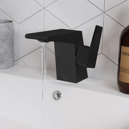 Single-handle bathroom faucet in matte black with angular spout and lever handle, water flowing.