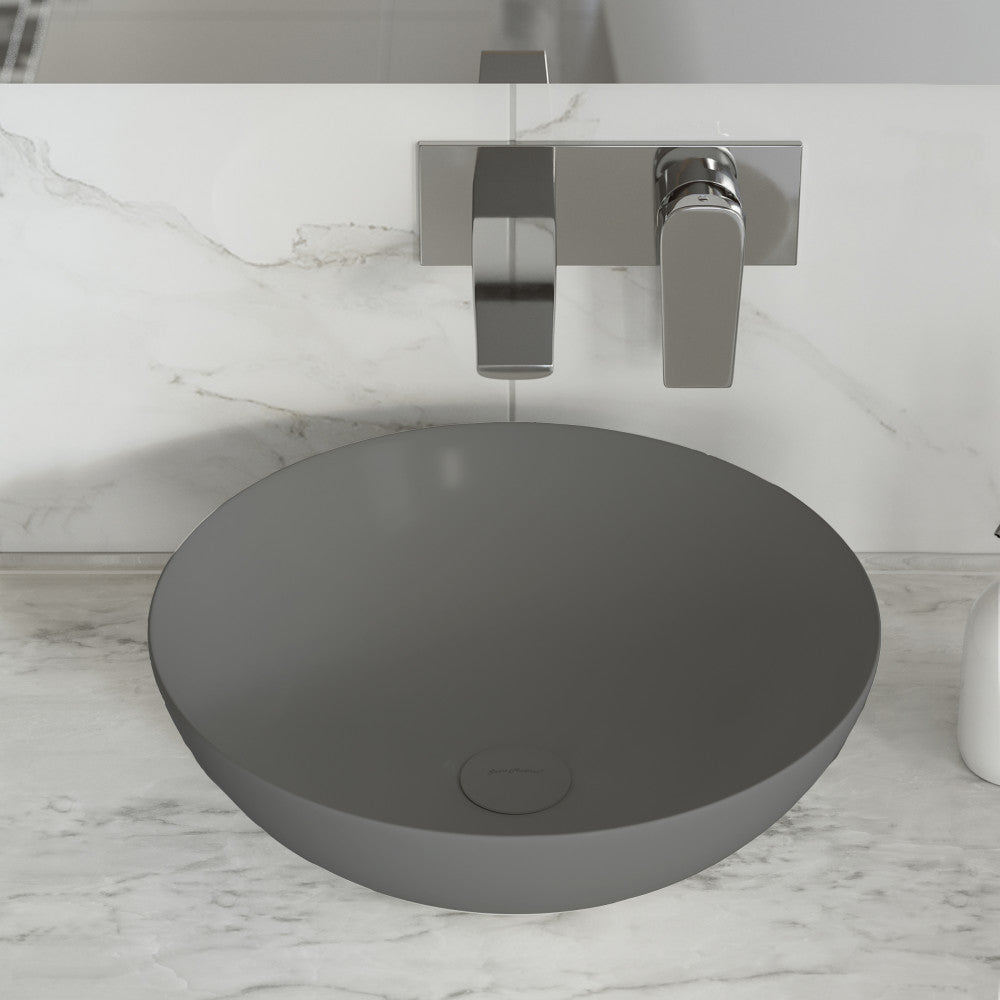 Matte gray ceramic vessel sink with round bowl and smooth finish.