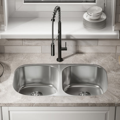32 x 18 stainless steel undermount kitchen sink with dual rectangular basins and drain holes.