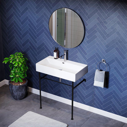 Small white rectangular console sink with slim black metal legs and single faucet hole, modern style.