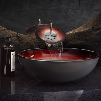 16.5-inch ember red glass vessel sink with waterfall faucet and matte black countertop.