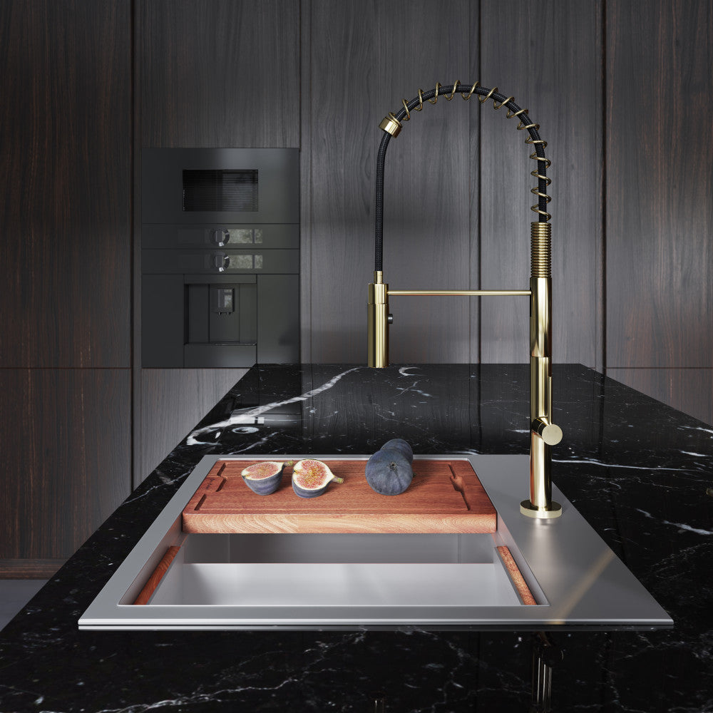 Pull-down single handle kitchen faucet in brushed gold with flexible coil spring spout.