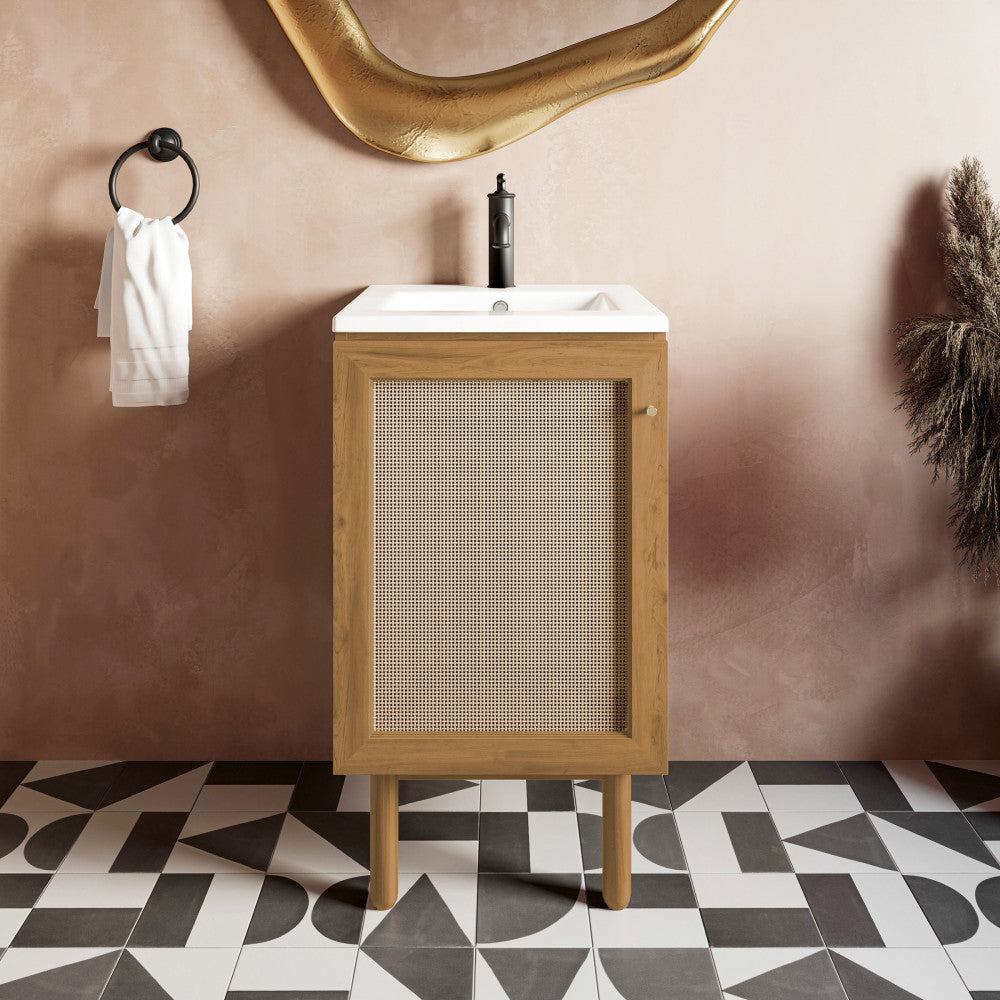 18-inch freestanding bathroom vanity in golden oak with single sink and black faucet.