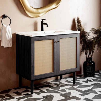 36-inch freestanding bathroom vanity in black oak with white sink top and black single-handle faucet.